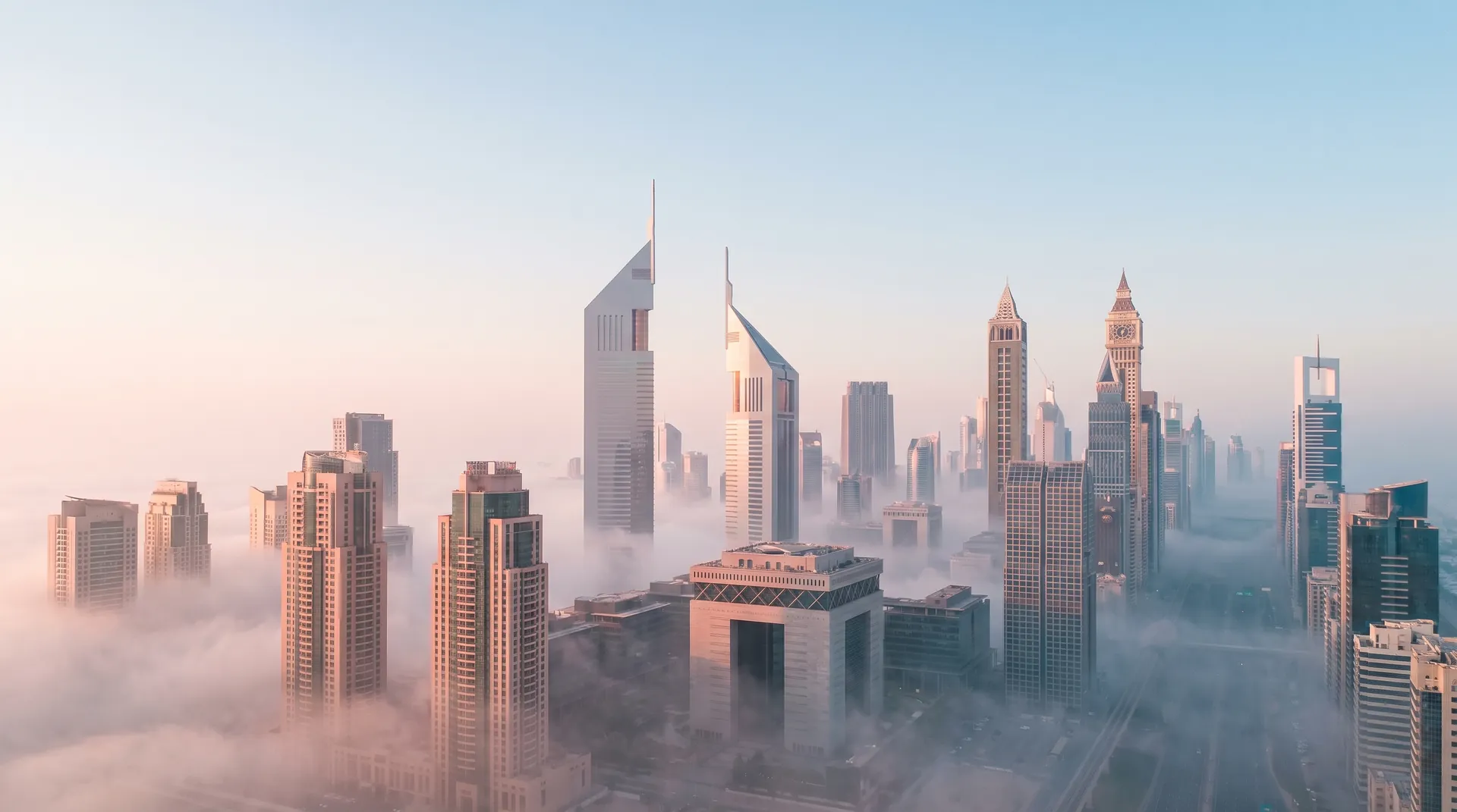 Dubai financial district skyline in morning fog for UK business setup and company formation